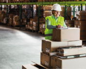 A woman packing boxes in a warehouse